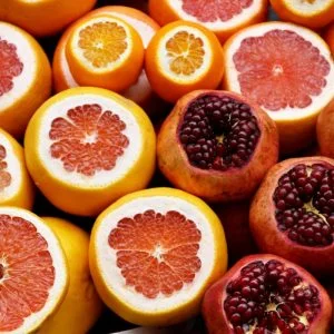 Sliced grapefruit, oranges and pomegranites
