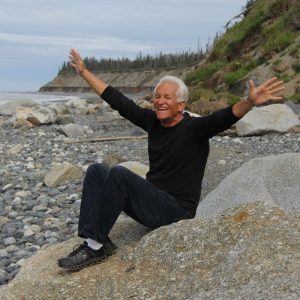 Happy older man with outstretched arms