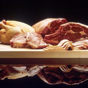 Poultry and red meat on cutting board