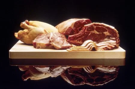 Poultry and red meat on cutting board