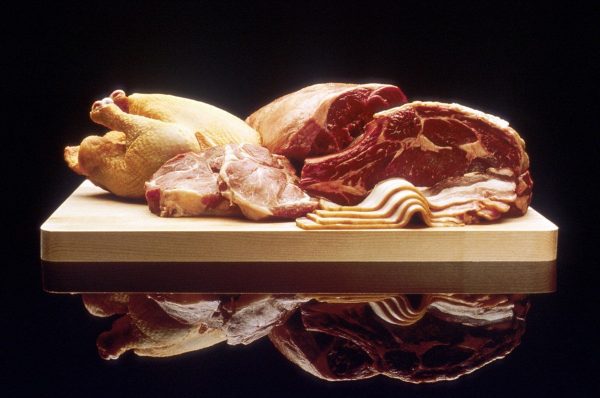 Poultry and red meat on cutting board
